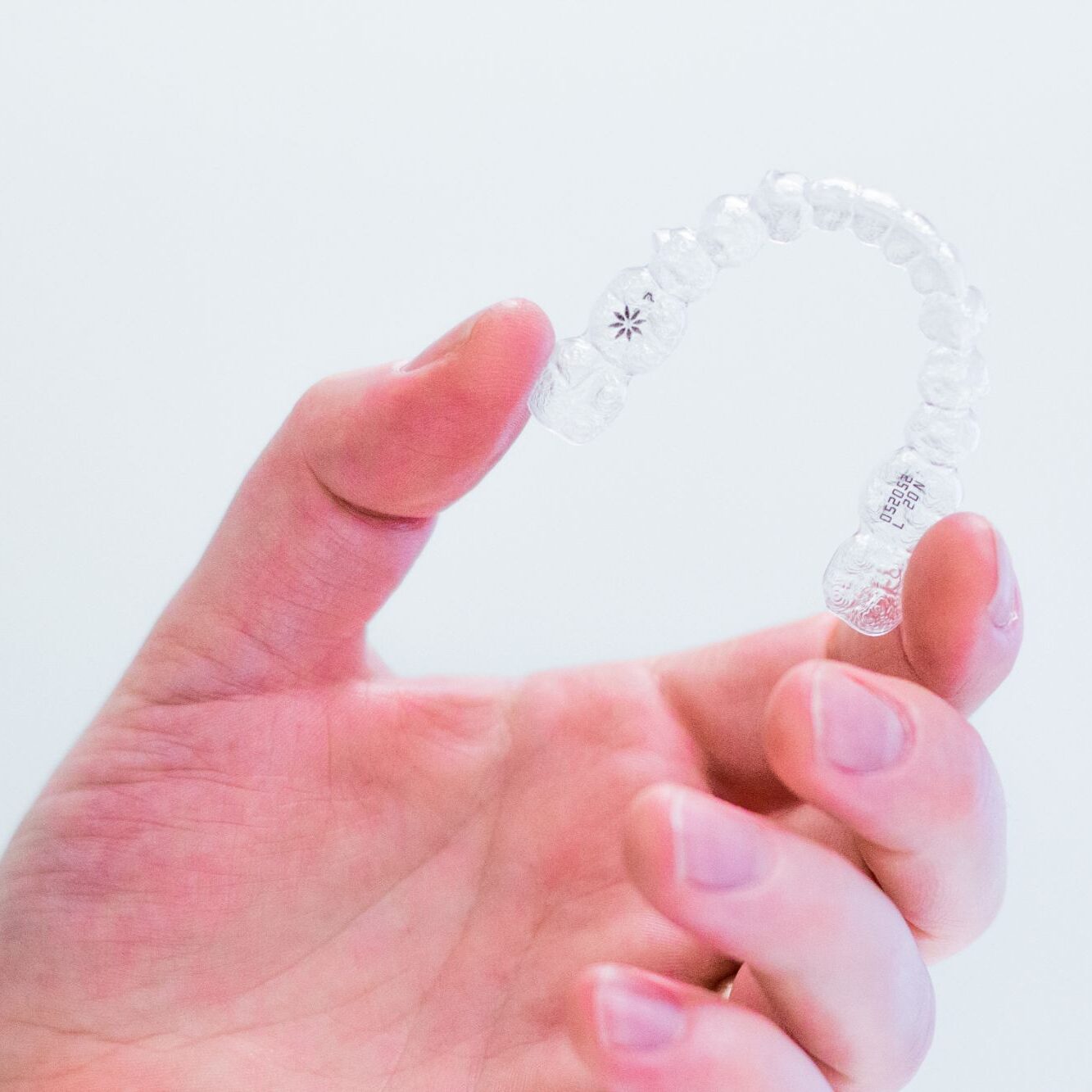 hand-holding-invisalign-aligners noblesville orthodontist